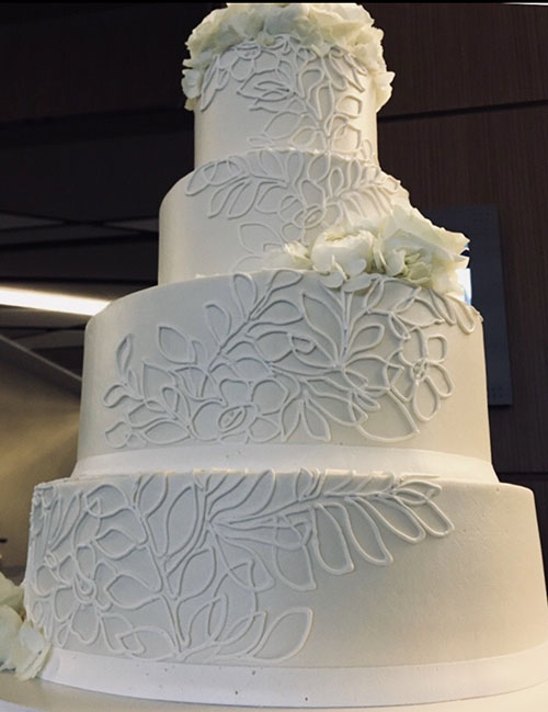 Elegant White Butter Cream Wedding Cake with a Louis Vuitt…